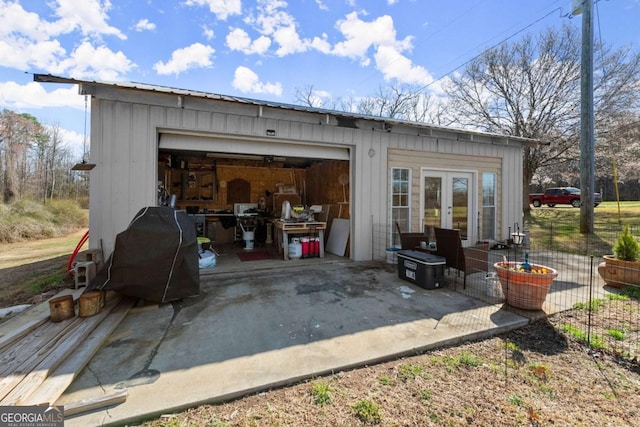 view of outdoor structure with an outbuilding and french doors