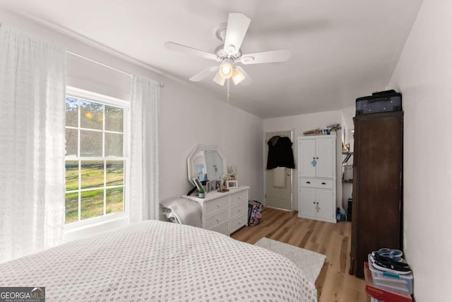 bedroom featuring a ceiling fan and light wood-style flooring