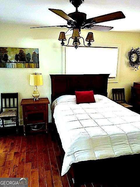 bedroom with wood finished floors