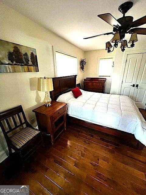 bedroom with ceiling fan and hardwood / wood-style floors