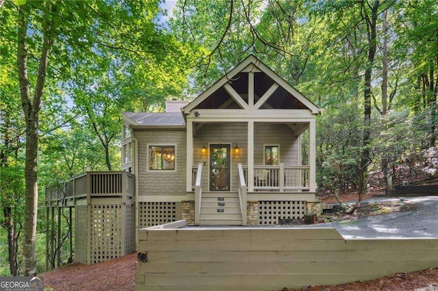 view of front of home featuring a porch and a shingled roof