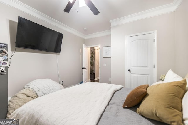 bedroom with ceiling fan and ornamental molding