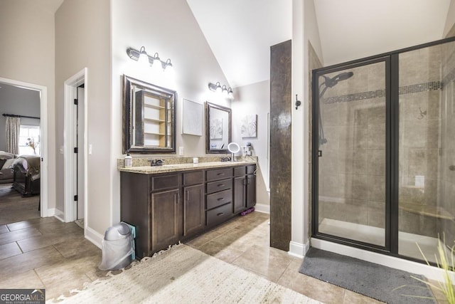 full bathroom with double vanity, a stall shower, ensuite bath, and a sink