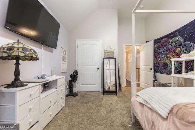 bedroom featuring high vaulted ceiling and light colored carpet