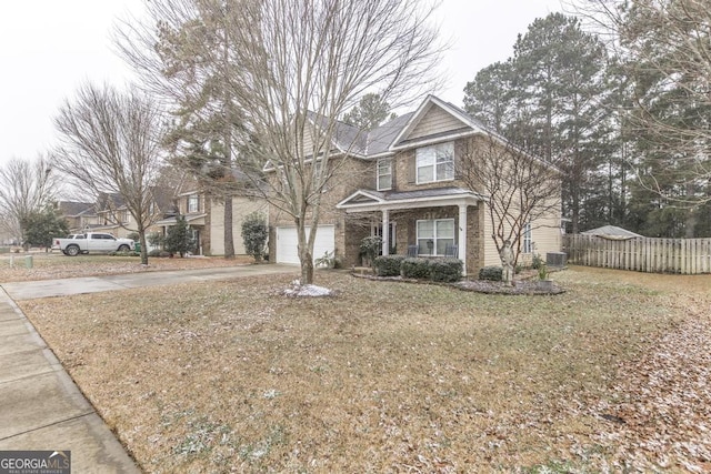 view of front of property featuring a garage, fence, central AC unit, and concrete driveway