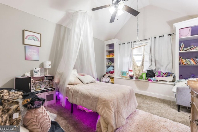 bedroom with carpet floors, baseboards, vaulted ceiling, and a ceiling fan