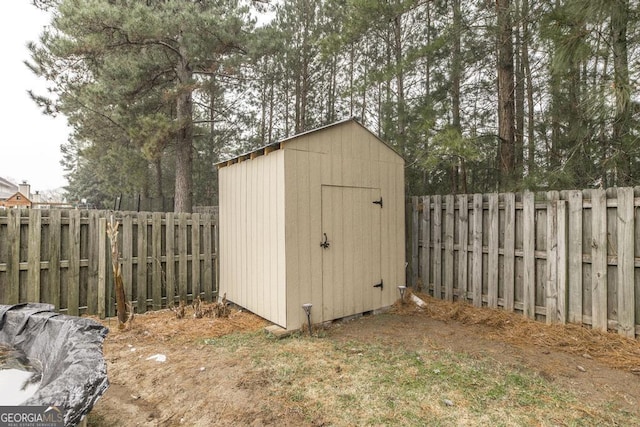 view of shed featuring a fenced backyard