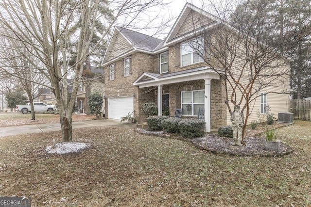 view of front of house with a porch, concrete driveway, central AC unit, fence, and a garage