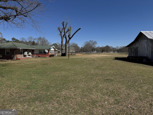 view of yard featuring an outbuilding and a barn