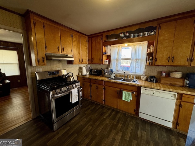 kitchen featuring stainless steel gas stove, dishwasher, brown cabinets, under cabinet range hood, and open shelves