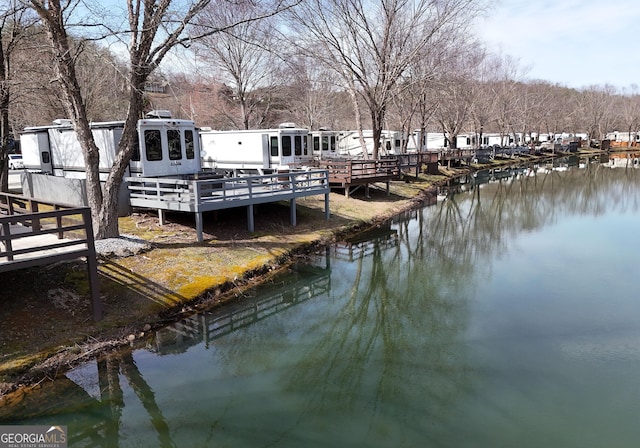 view of dock featuring a deck with water view