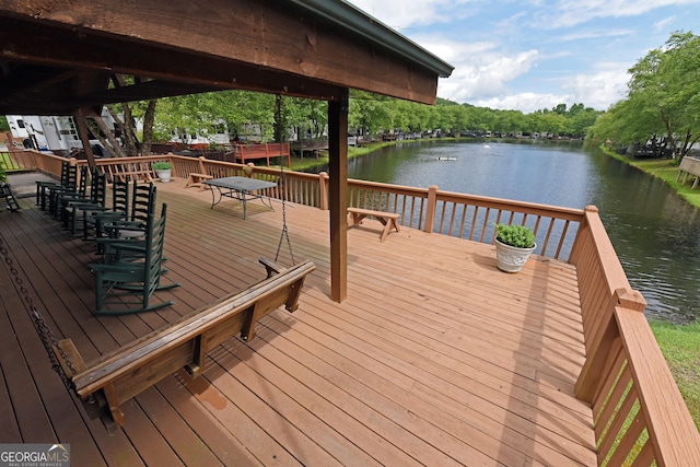 wooden deck with a water view