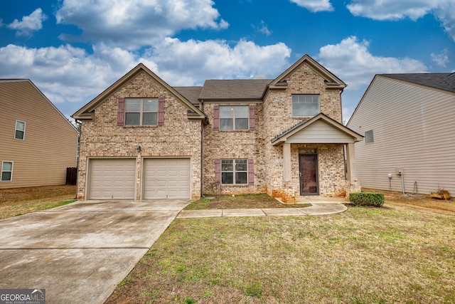 traditional-style home with driveway, a front yard, a garage, and brick siding