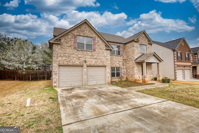 traditional home with concrete driveway, an attached garage, fence, a front lawn, and brick siding