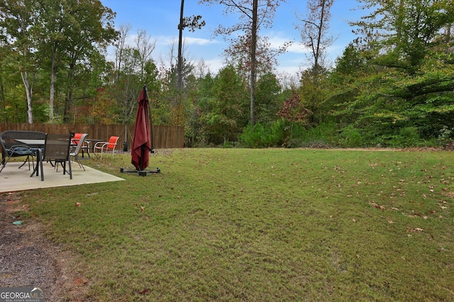 view of yard featuring a patio and fence