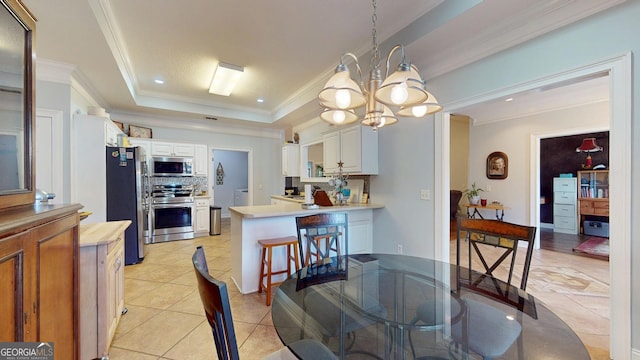 dining area with ornamental molding, recessed lighting, a raised ceiling, and light tile patterned floors