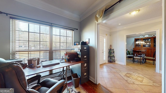 office space with light tile patterned floors, baseboards, and crown molding