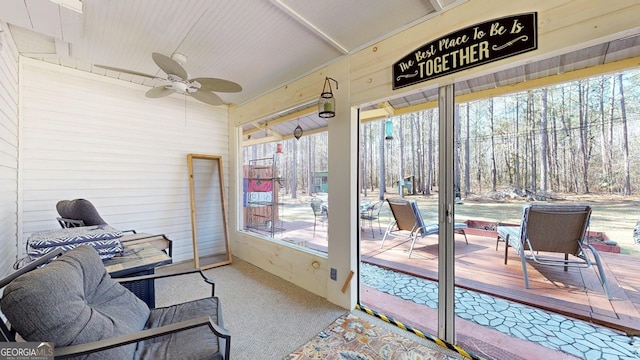 sunroom with a healthy amount of sunlight and ceiling fan