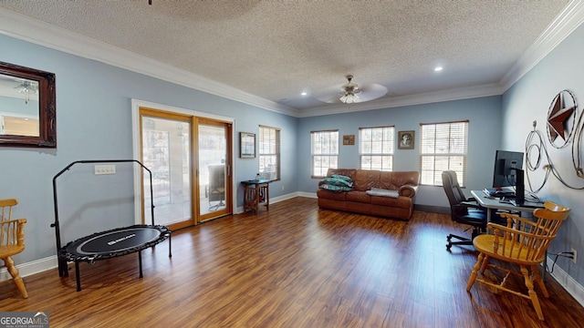 office area featuring baseboards, ornamental molding, and wood finished floors