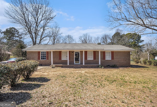 single story home with crawl space, a front lawn, and brick siding