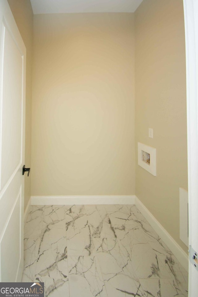 washroom featuring marble finish floor, laundry area, hookup for a washing machine, and baseboards