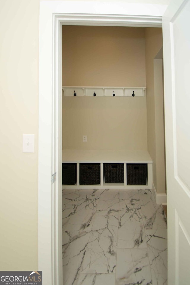 mudroom featuring marble finish floor