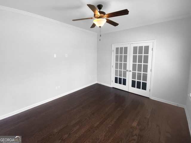 spare room with french doors, dark wood-style flooring, ornamental molding, ceiling fan, and baseboards