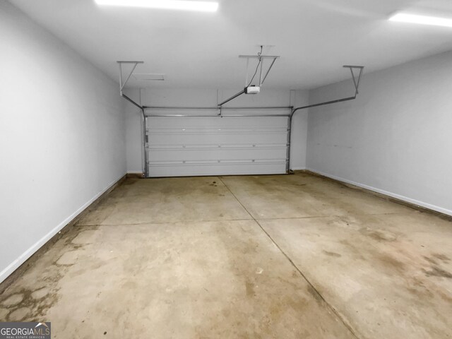 362 Reserve Overlook, Canton, GA 30115 - garage with baseboards and a garage door opener
