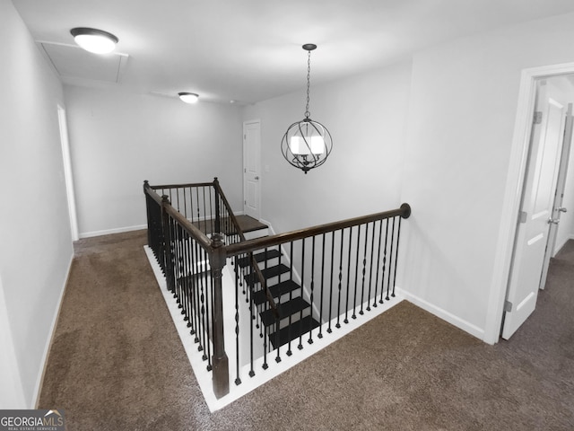 stairway with carpet floors and baseboards