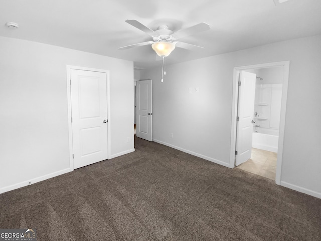 unfurnished bedroom featuring carpet, ceiling fan, ensuite bath, and baseboards