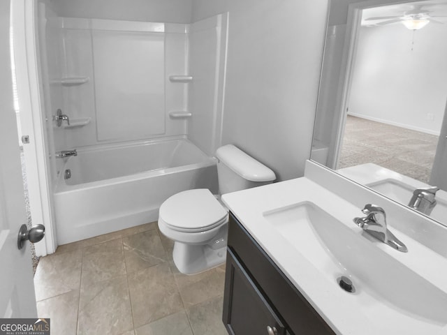 bathroom with vanity, toilet, and shower / bathtub combination