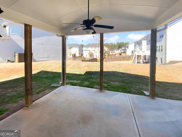 view of patio with ceiling fan, a residential view, and fence