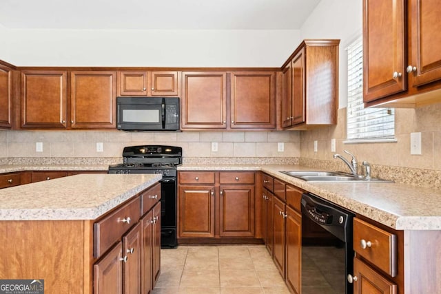 kitchen featuring light tile patterned floors, a sink, light countertops, black appliances, and tasteful backsplash