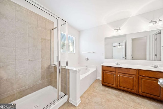 full bathroom with a sink, a shower stall, a bath, tile patterned floors, and double vanity