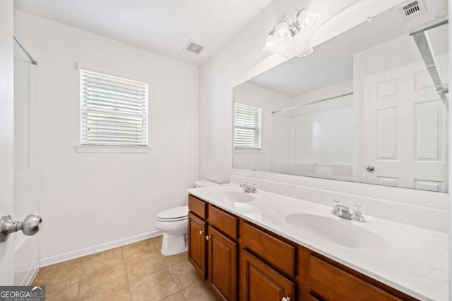 full bath with toilet, walk in shower, a sink, and visible vents