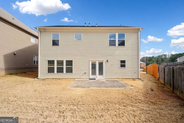 back of house with fence and a patio