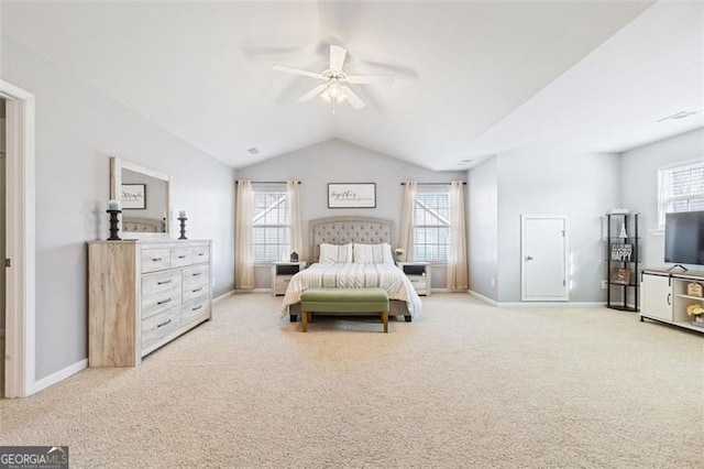 carpeted bedroom with vaulted ceiling, multiple windows, and baseboards