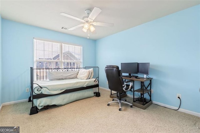 bedroom with visible vents, baseboards, and ceiling fan