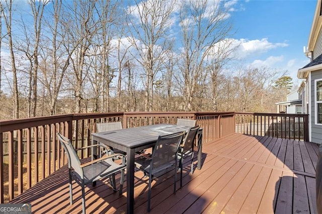 wooden deck featuring outdoor dining space