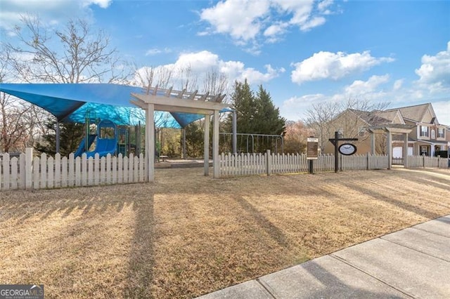 view of yard with a playground and fence