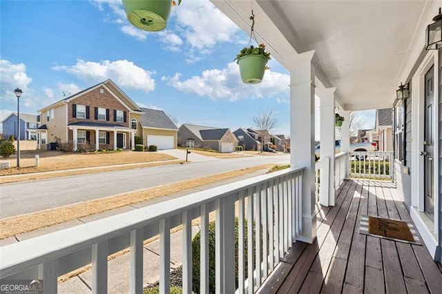 balcony featuring a residential view and a porch