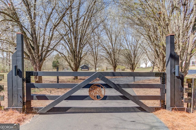 view of gate with fence