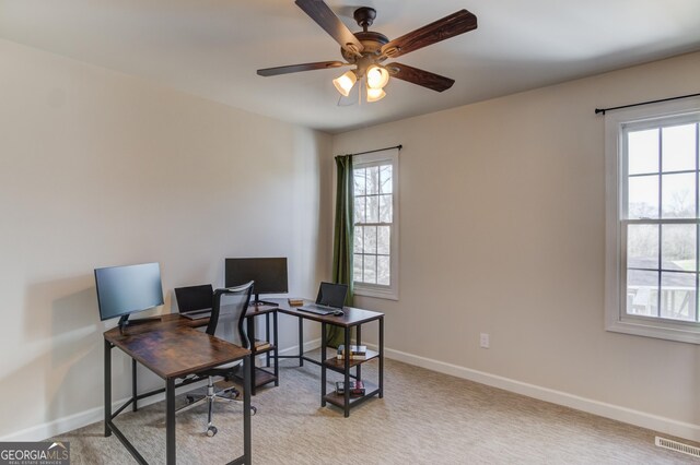 bedroom with light carpet, ceiling fan, and baseboards