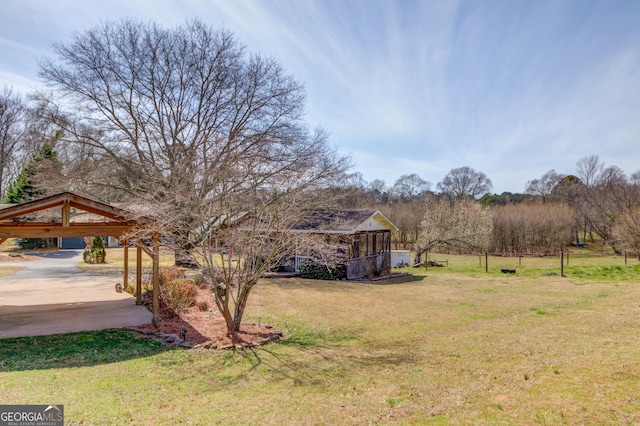 view of yard with a detached carport