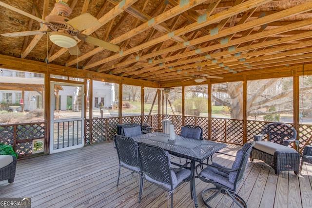 sunroom with a ceiling fan