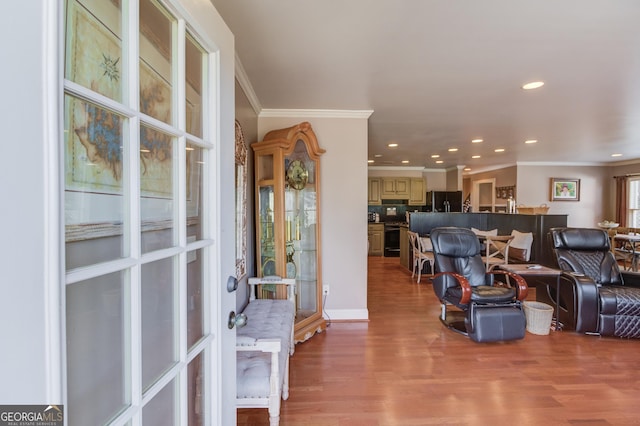 entrance foyer with ornamental molding, recessed lighting, and wood finished floors