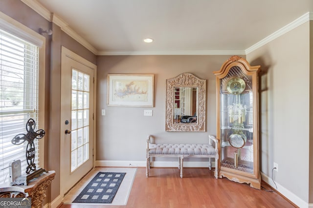 doorway to outside with light wood-style flooring, recessed lighting, baseboards, french doors, and ornamental molding