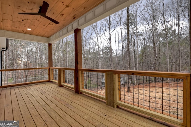 wooden terrace featuring ceiling fan