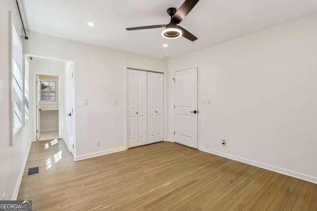 unfurnished bedroom with light wood-style floors, recessed lighting, visible vents, and baseboards