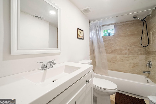 bathroom featuring toilet, visible vents, shower / bath combination with curtain, and vanity